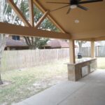 Custom covered patio with outdoor bar/grill area. Full electric, custom coloring and granite countertops