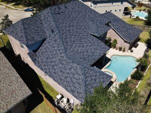 30-year architectural shingle roof with ridge vent and painted pipe jacks.