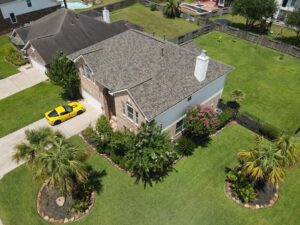 30-year architectural shingle roof with ridge vent and painted pipe jacks.