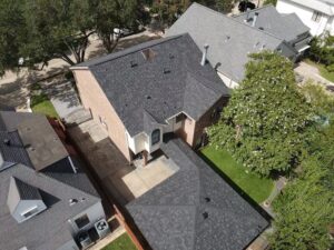 30-year architectural shingle roof with ridge vent and painted pipe jacks.