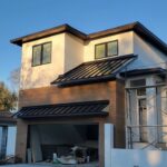Standing seam metal roof accent on new home build